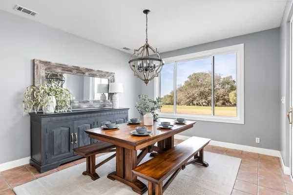 a bathroom with double vanity sinks a vanity a mirror and a shower