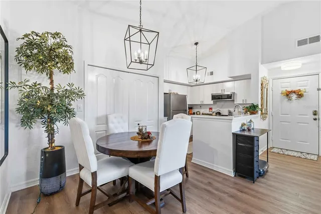 a kitchen with stainless steel appliances a refrigerator sink and microwave