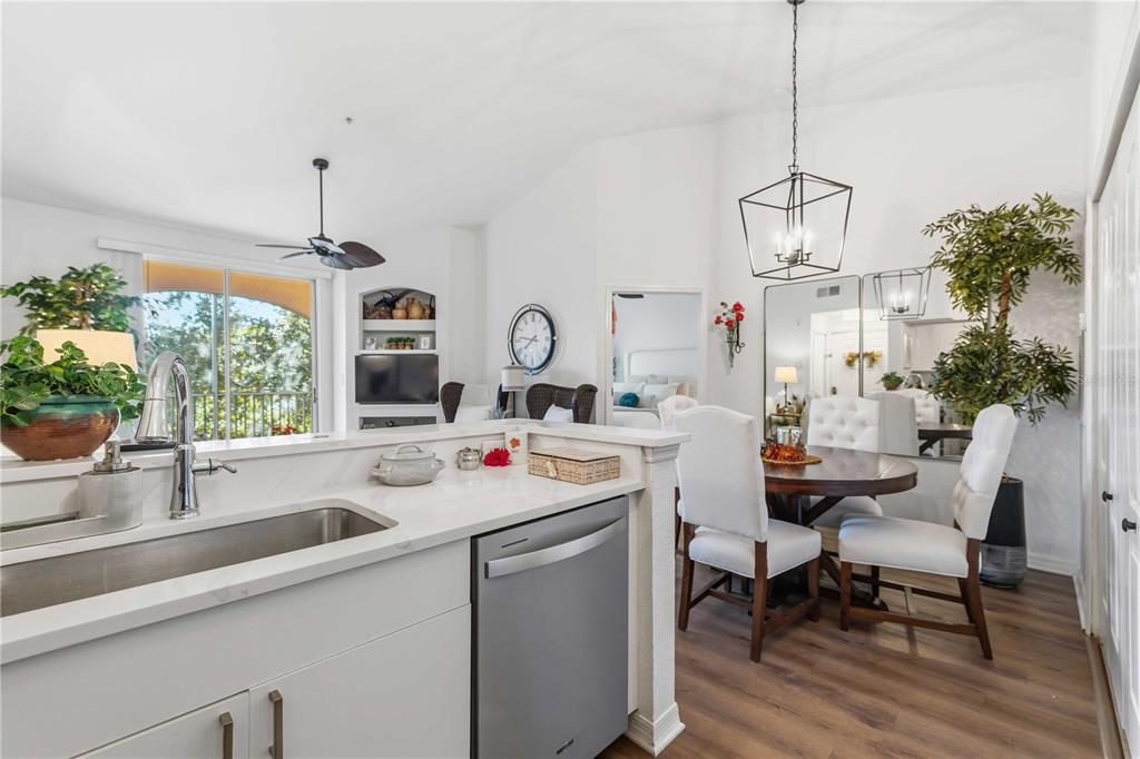 4110 Central Sarasota Parkway, Unit 134 Sarasota, FL 34238 - Photo 15 of 32 a view of a kitchen area with furniture and window