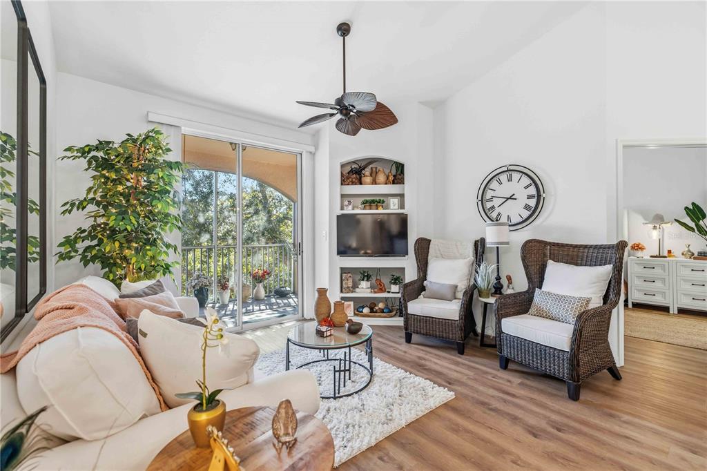 4110 Central Sarasota Parkway, Unit 134 Sarasota, FL 34238 - Photo 18 of 32 a living room with furniture and a large window