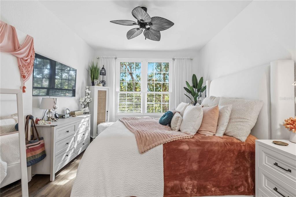 4110 Central Sarasota Parkway, Unit 134 Sarasota, FL 34238 - Photo 20 of 32 a bedroom with bed and windows