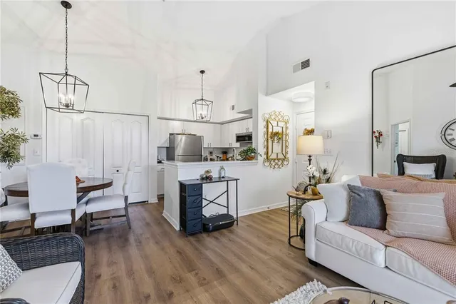 a kitchen with refrigerator and microwave