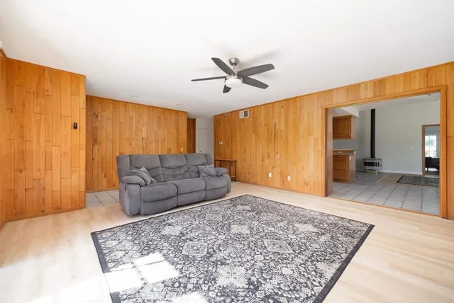 a living room with a couch and a rug