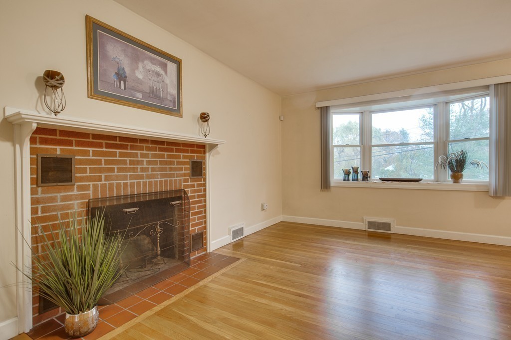 11 Douglas Road Chelmsford, MA 01824 - Photo 6 of 18 a view of an empty room with glass door and wooden floor
