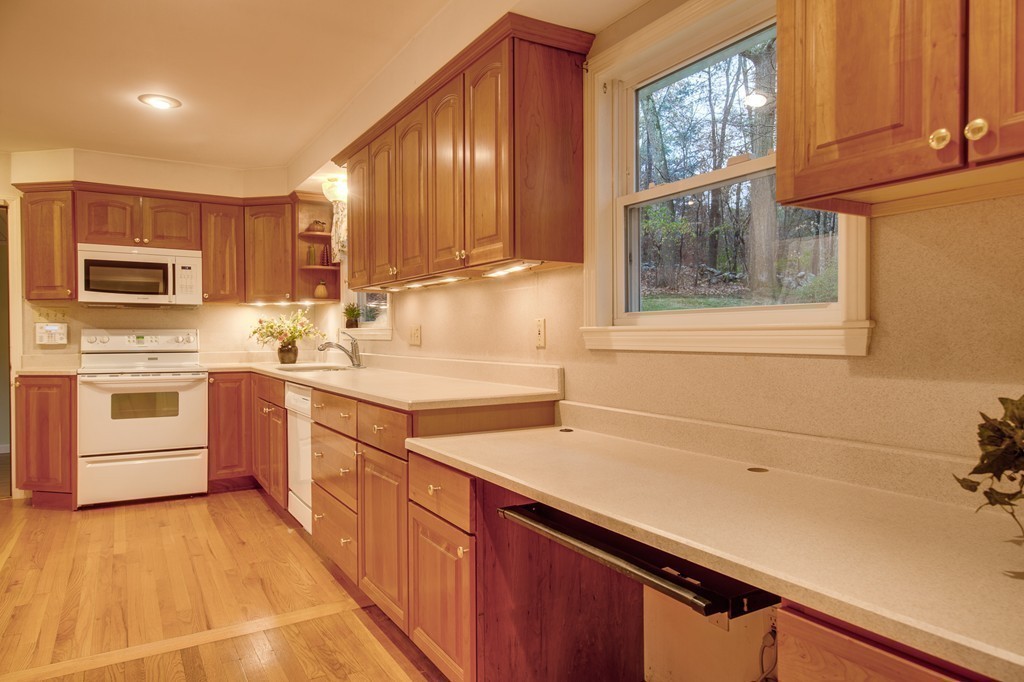 11 Douglas Road Chelmsford, MA 01824 - Photo 8 of 18 a kitchen with stainless steel appliances sink cabinets and window