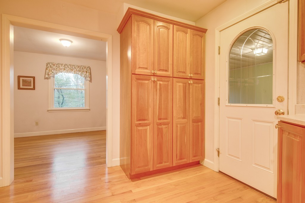 11 Douglas Road Chelmsford, MA 01824 - Photo 10 of 18 an empty room with wooden floor cabinet and windows