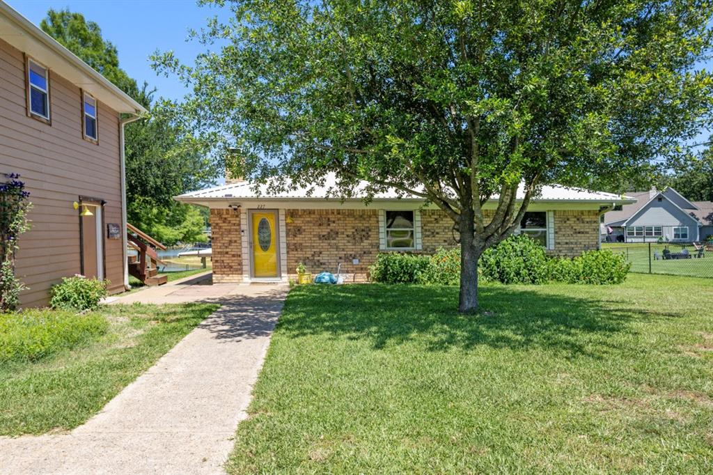 227 Scenic Road Trinidad, TX 75163 - Photo 3 of 40 a front view of a house with garden