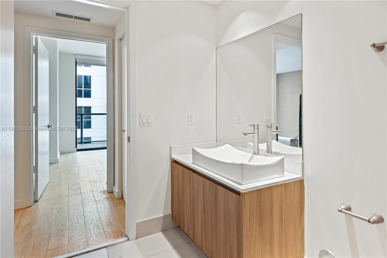 201 Southwest 17th Road, Unit 502 Miami, FL 33129 - Photo 17 of 17 a bathroom with a sink and a mirror