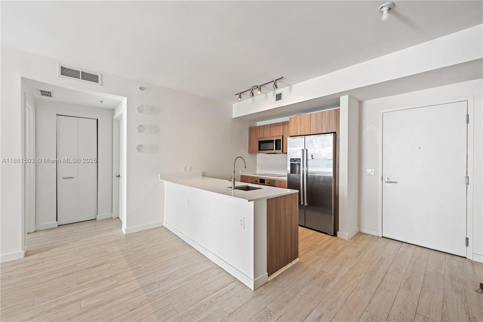 201 Southwest 17th Road, Unit 502 Miami, FL 33129 - Photo 2 of 17 a kitchen with stainless steel appliances granite countertop a refrigerator and a stove top oven