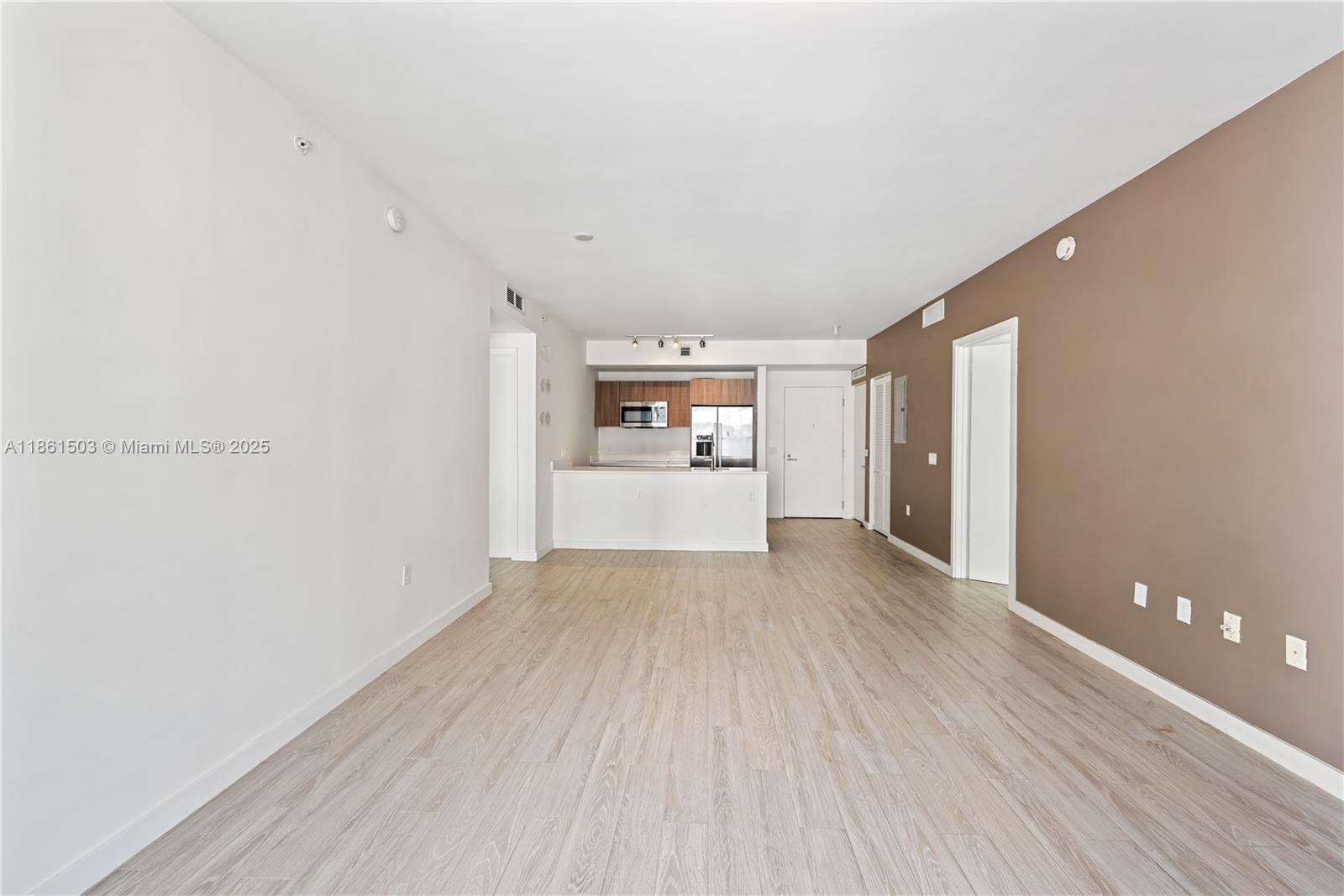 201 Southwest 17th Road, Unit 502 Miami, FL 33129 - Photo 3 of 17 a view of a kitchen with wooden floor and a kitchen