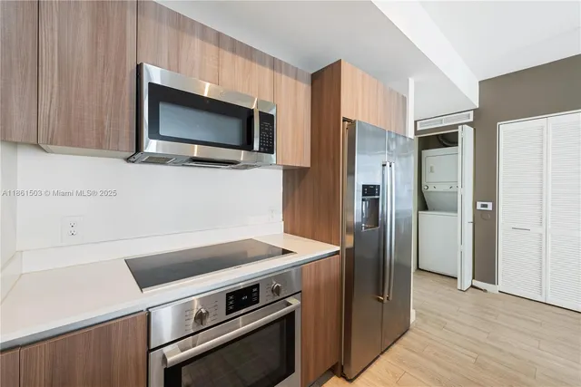 a kitchen with a stove and a microwave