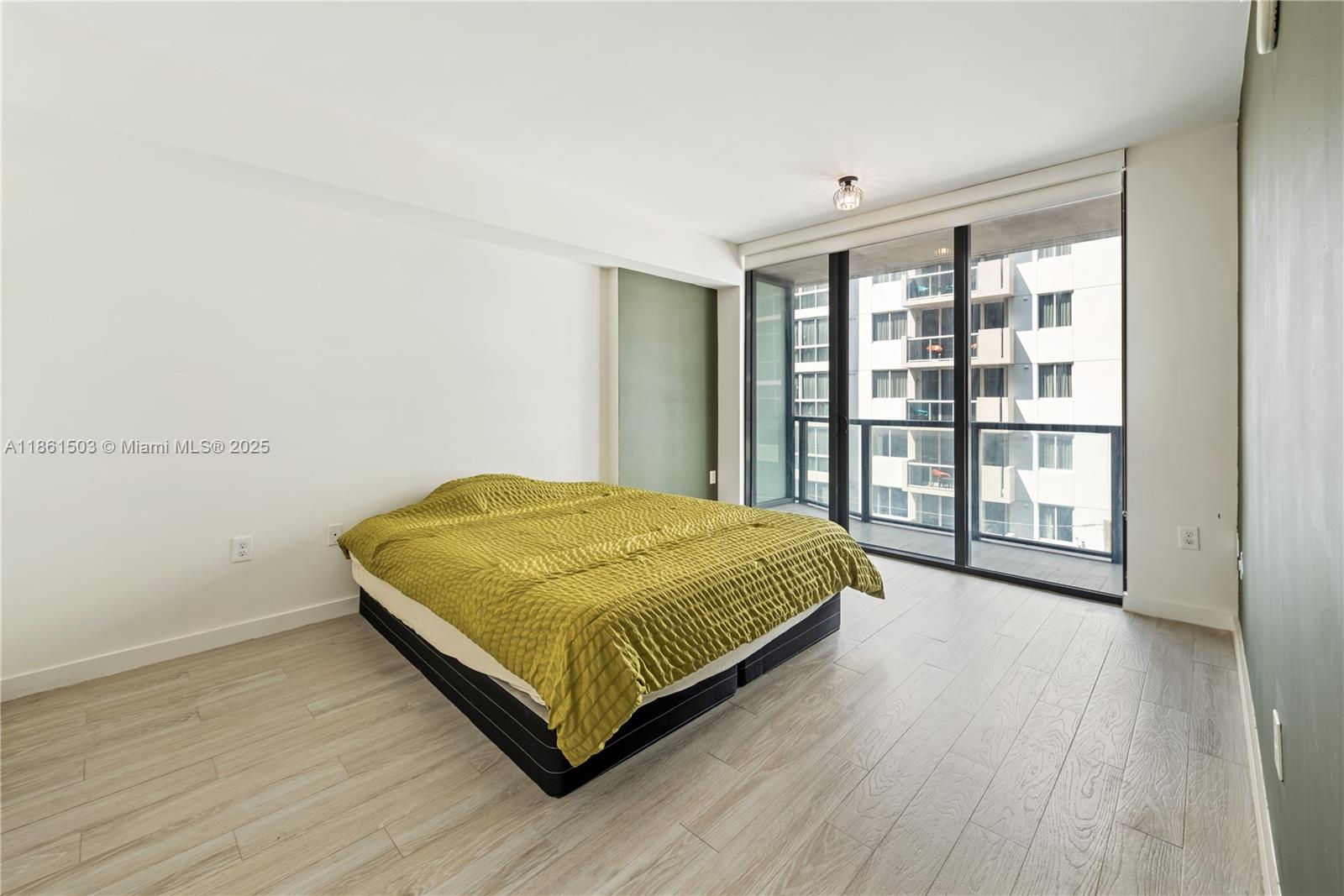 201 Southwest 17th Road, Unit 502 Miami, FL 33129 - Photo 8 of 17 a bedroom with a bed and a large window