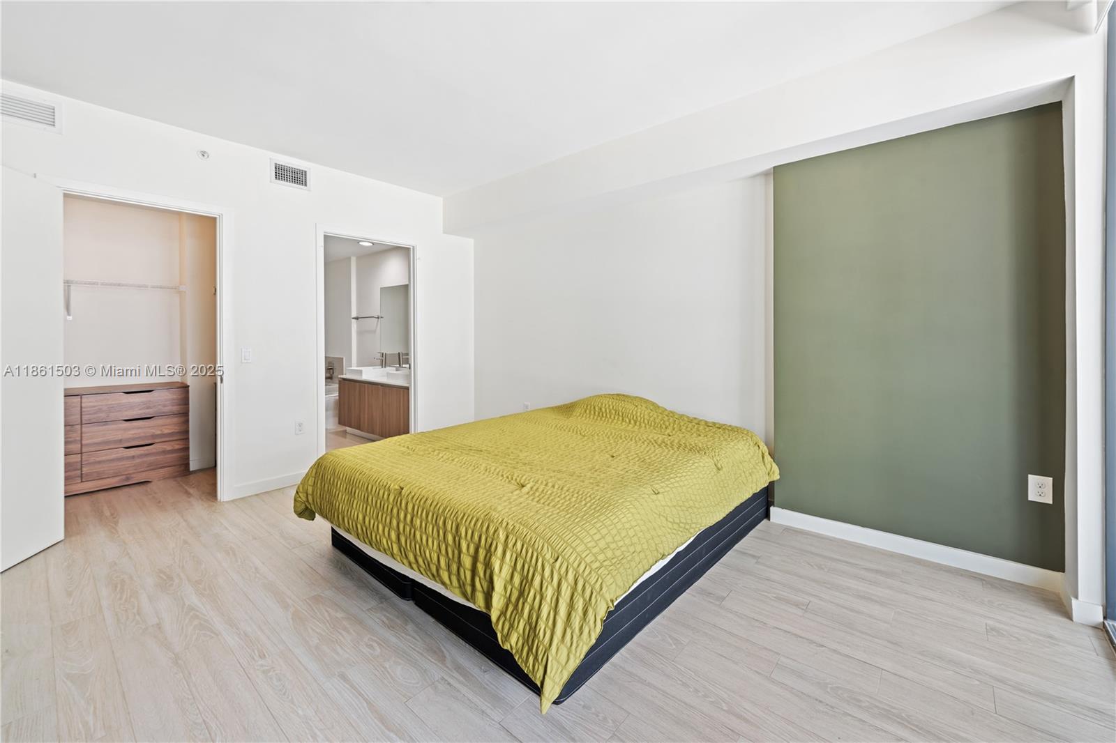 201 Southwest 17th Road, Unit 502 Miami, FL 33129 - Photo 10 of 17 a bedroom with a bed and a table