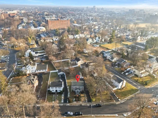 an aerial view of residential building and parking space