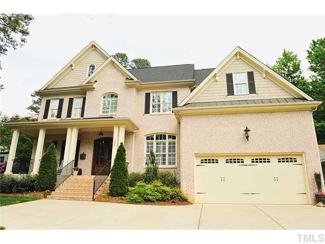 1336 Banbury Road Raleigh, NC 27607 - Photo 1 of 12 a view of a brick house with large windows