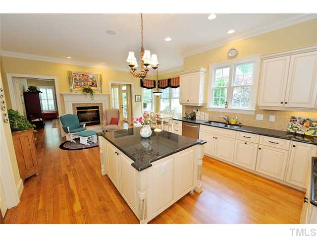 1336 Banbury Road Raleigh, NC 27607 - Photo 6 of 12 a kitchen with stainless steel appliances granite countertop a stove refrigerator and cabinets