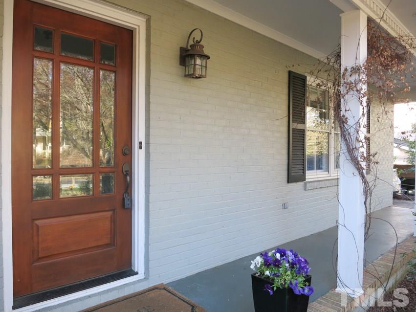 912 Hardimont Road Raleigh, NC 27609 - Photo 2 of 25 a vase of flowers sitting in front of a door