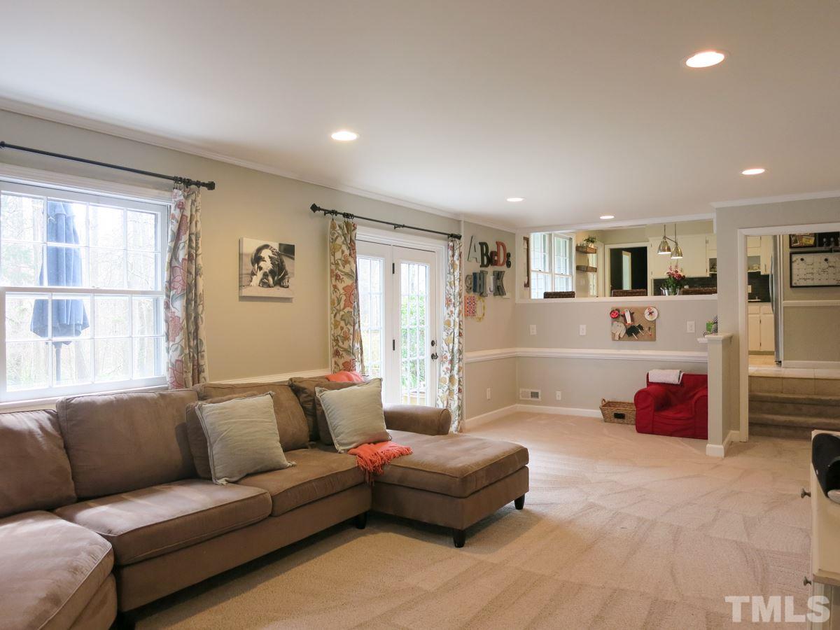 912 Hardimont Road Raleigh, NC 27609 - Photo 13 of 25 a living room with furniture window and a table
