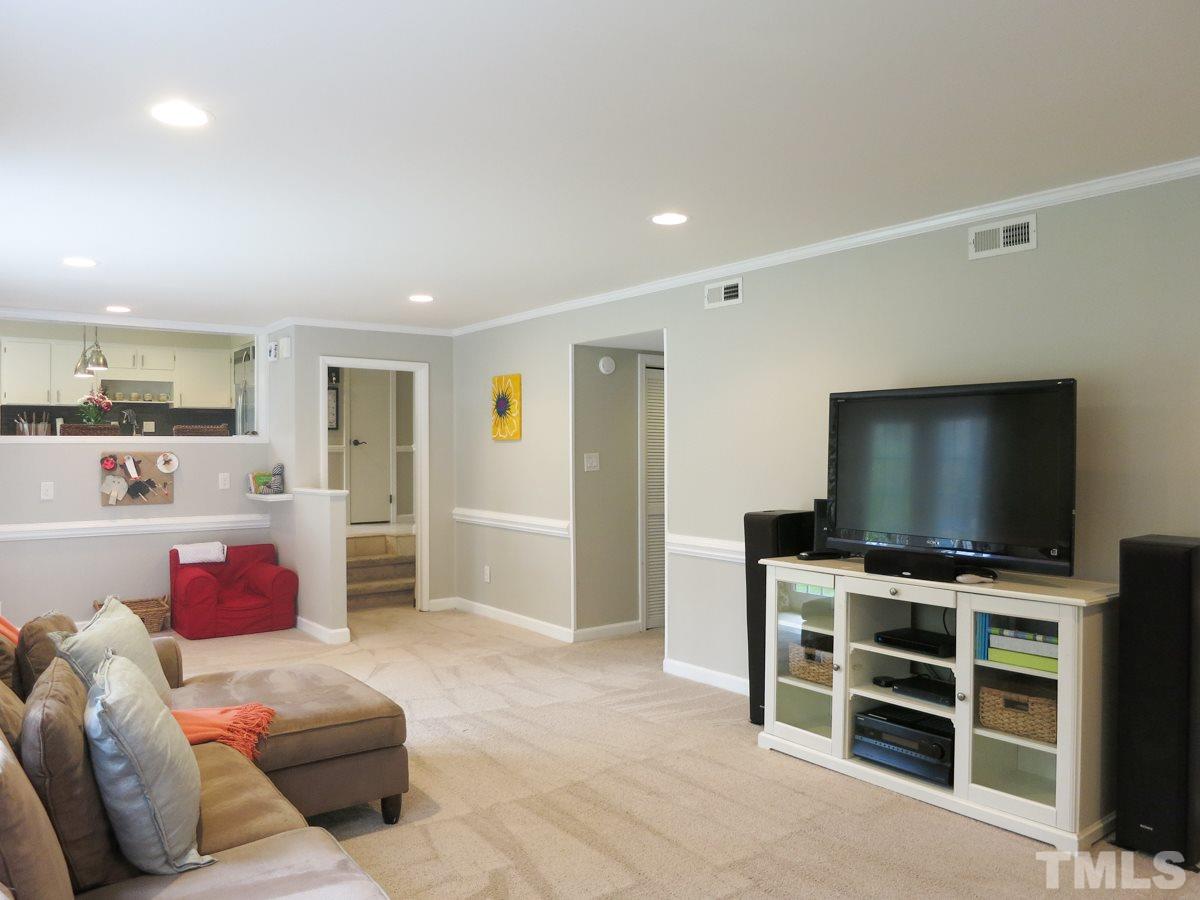 912 Hardimont Road Raleigh, NC 27609 - Photo 14 of 25 a living room with furniture and a flat screen tv