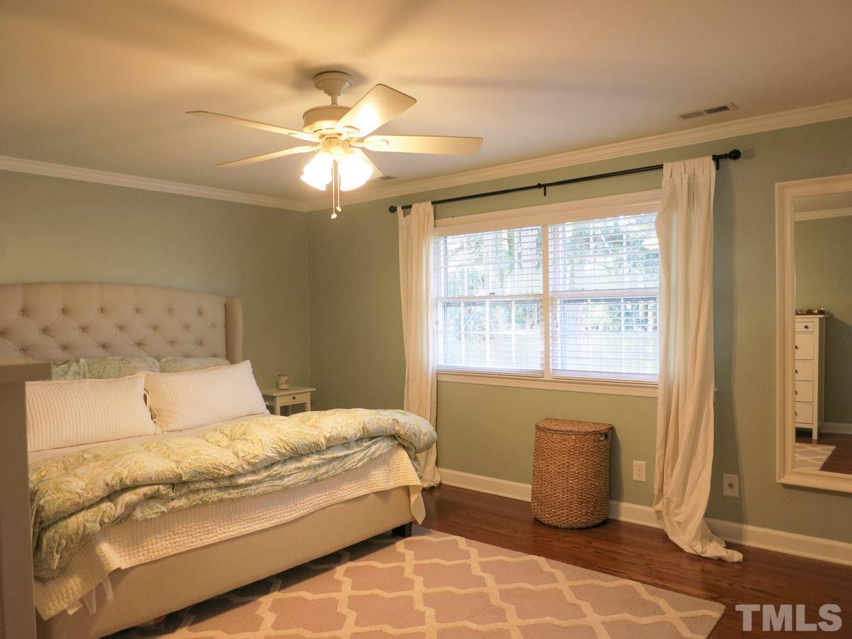 912 Hardimont Road Raleigh, NC 27609 - Photo 17 of 25 a bedroom with a bed and a window