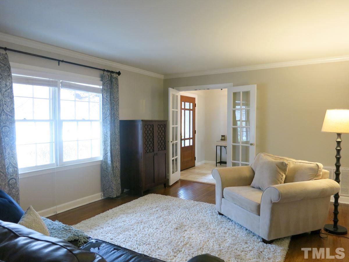 912 Hardimont Road Raleigh, NC 27609 - Photo 4 of 25 a living room with furniture and a window