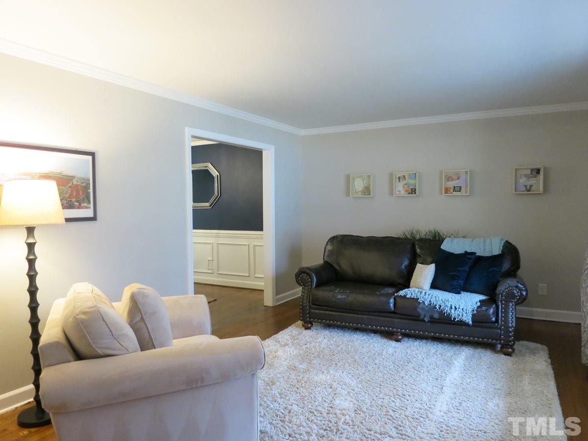 912 Hardimont Road Raleigh, NC 27609 - Photo 5 of 25 a living room with furniture and a window