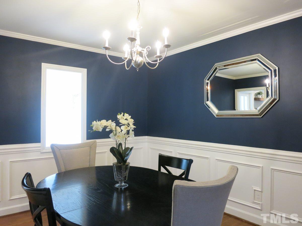 912 Hardimont Road Raleigh, NC 27609 - Photo 6 of 25 a dining room with chandelier and wooden floor