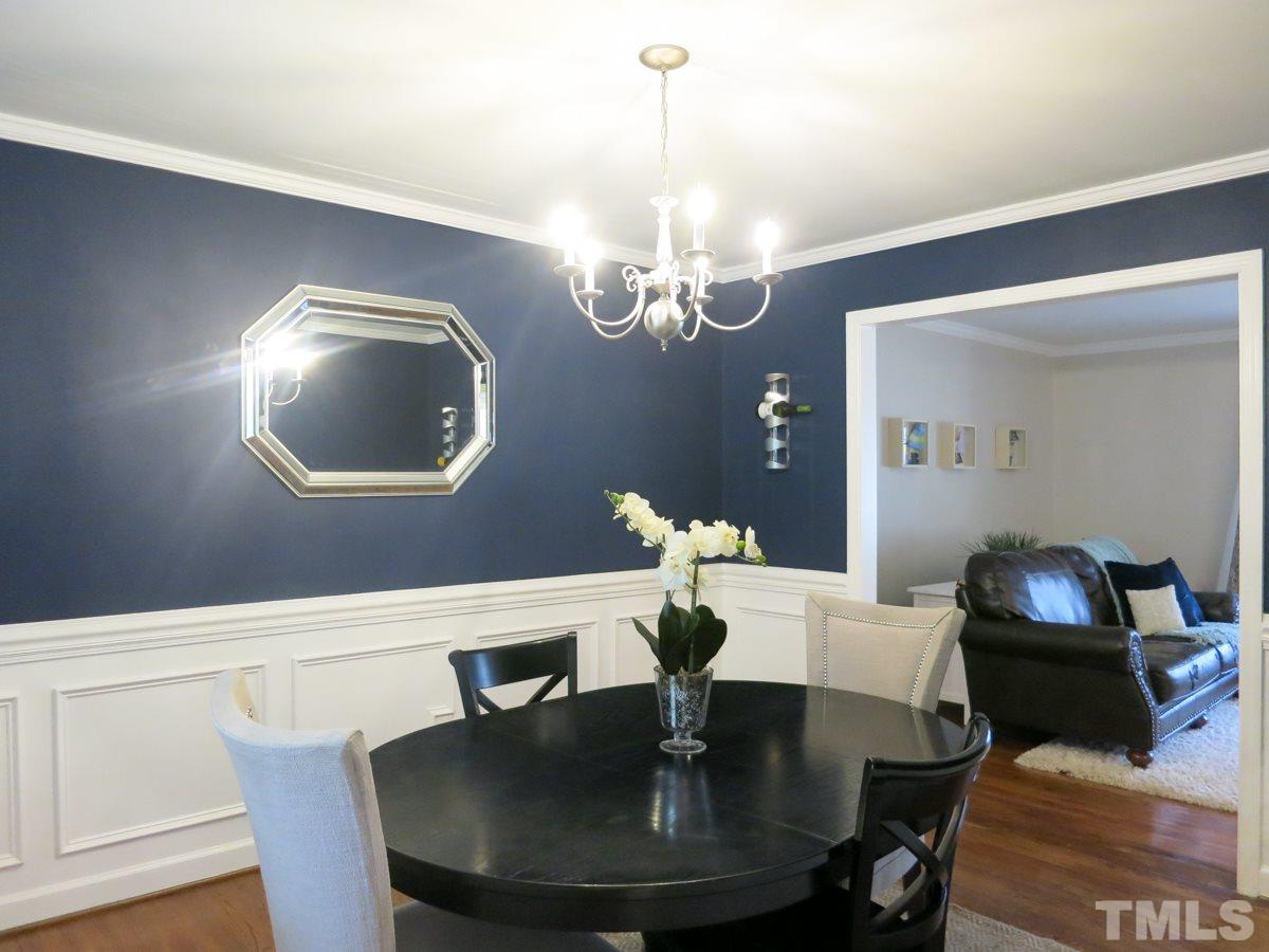 912 Hardimont Road Raleigh, NC 27609 - Photo 7 of 25 a view of a dining room with furniture and chandelier