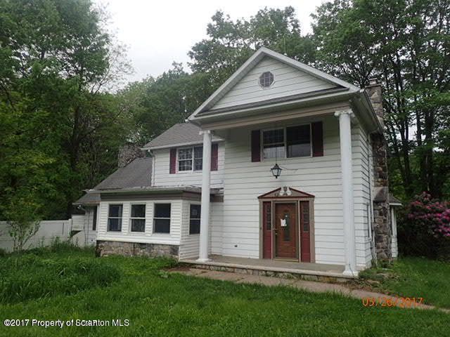 13 Elias Road Moscow, PA 18444 - Photo 1 of 1 a front view of a house with a yard