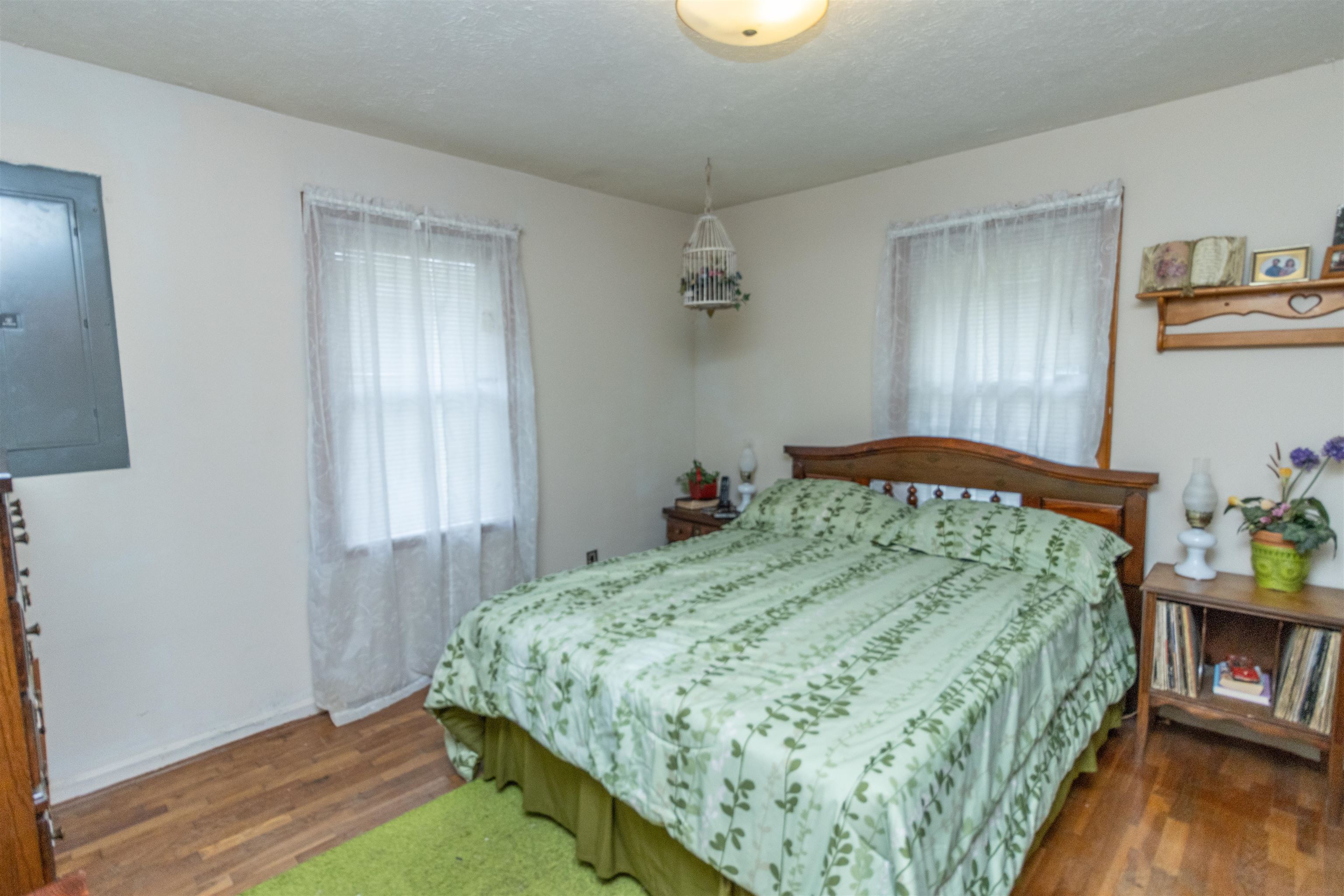33 Skyline Road Selmer, TN 38375 - Photo 10 of 19 Bedroom featuring electric panel and dark hardwood / wood-style flooring