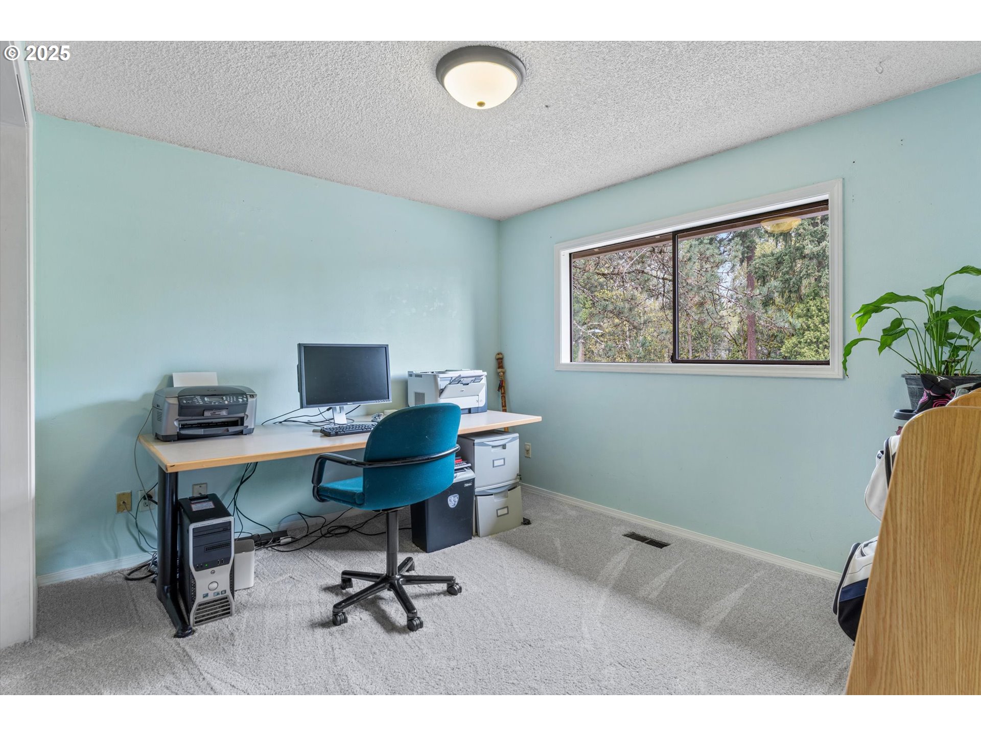 756 Southeast 27th Street Gresham, OR 97080 - Photo 18 of 46 a view of a workspace with furniture and a window