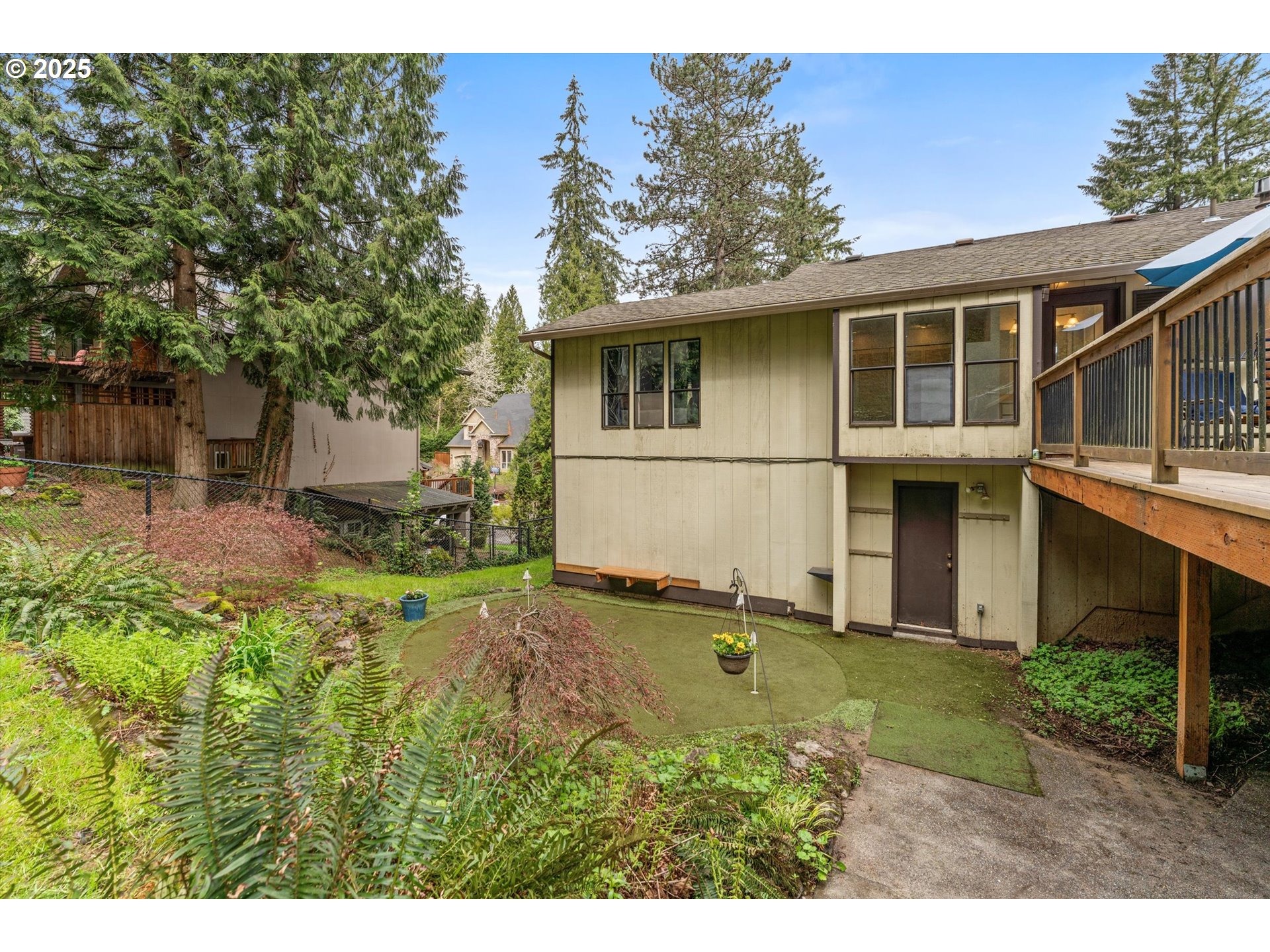 756 Southeast 27th Street Gresham, OR 97080 - Photo 35 of 46 a view of a backyard with plants and large tree