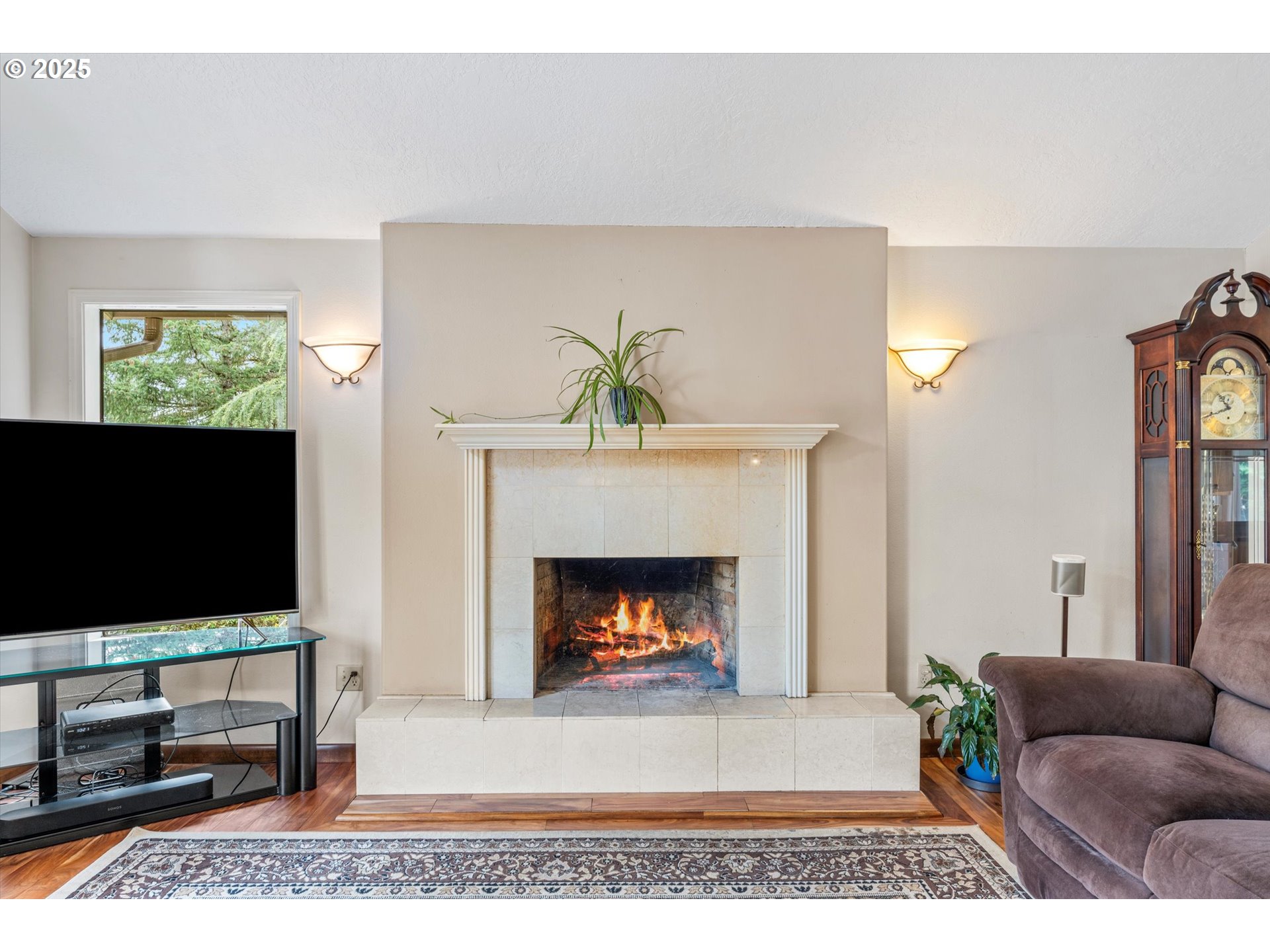 756 Southeast 27th Street Gresham, OR 97080 - Photo 7 of 46 a living room with furniture a flat screen tv and a fireplace