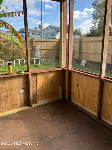 a view of a room with a large window