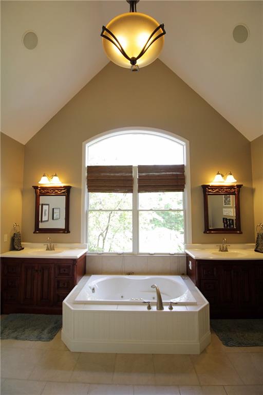 2138 Beams Run Road Jefferson Hills, PA 15025 - Photo 11 of 25 The master suite has a walk-in closet and luxurious bath with a vaulted ceiling, jet tub, separate shower, and dual vanity sinks.