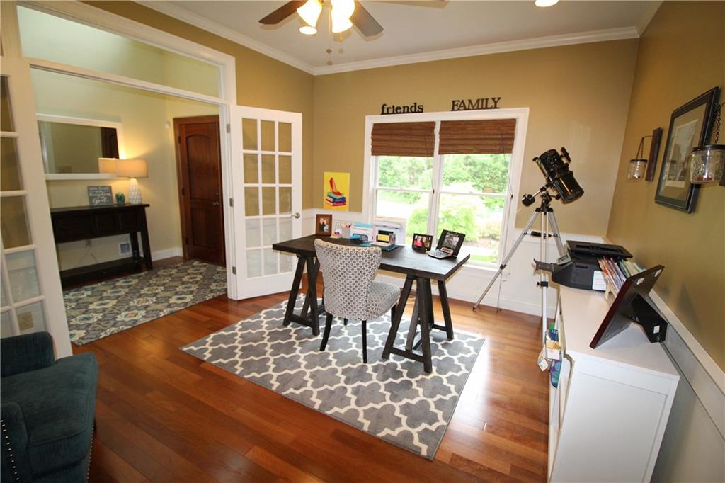 2138 Beams Run Road Jefferson Hills, PA 15025 - Photo 3 of 25 French doors from foyer lead to the home office accented with crown and chair rail moldings and hardwood floor. This room could also be a formal dining room or living room.