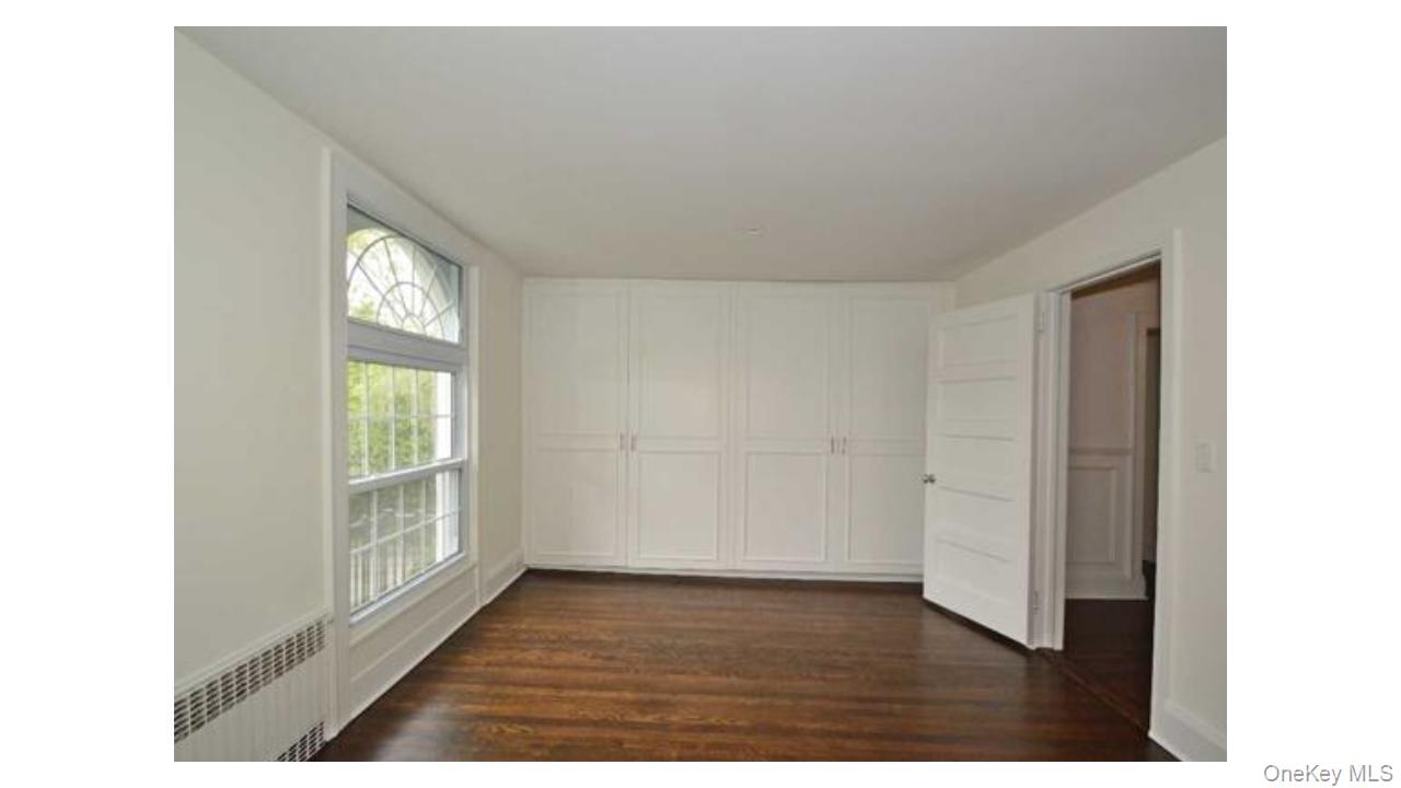 2 Arleigh Road Great Neck, NY 11021 - Photo 14 of 22 Hardwood flooring and built-in cabinetry enhance this room