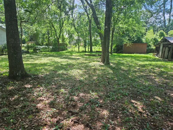 a view of outdoor space with deck and tree
