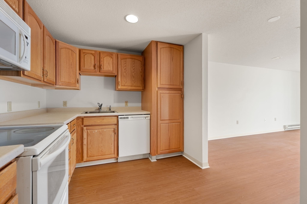 2 Ocean Avenue, Unit 2K Gloucester, MA 01930 - Photo 16 of 26 a view of a kitchen with sink and cabinets