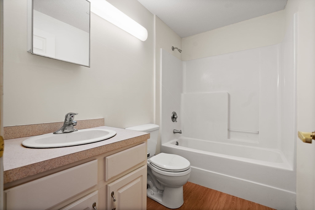 2 Ocean Avenue, Unit 2K Gloucester, MA 01930 - Photo 21 of 26 a bathroom with a sink a toilet and a bathtub