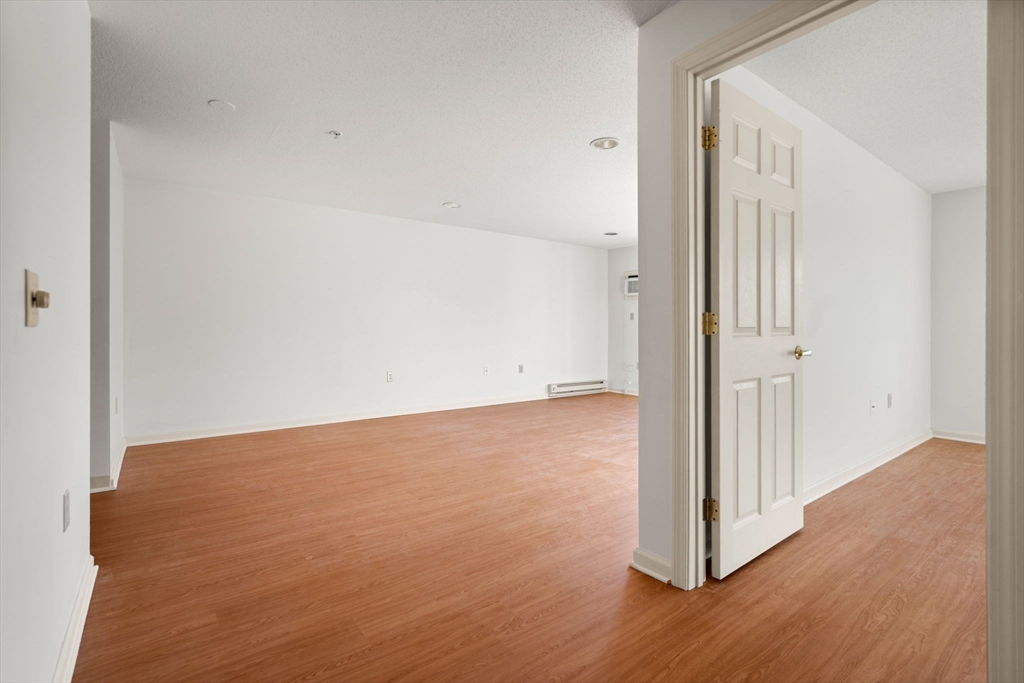 2 Ocean Avenue, Unit 2K Gloucester, MA 01930 - Photo 22 of 26 a view of a room with wooden floor