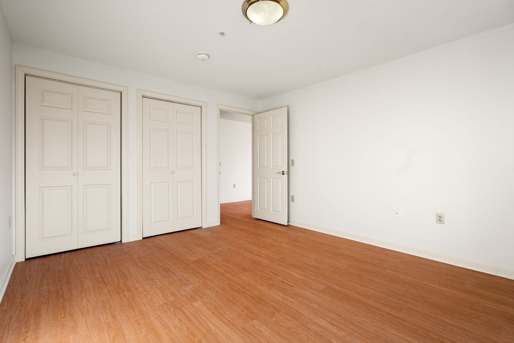 2 Ocean Avenue, Unit 2K Gloucester, MA 01930 - Photo 24 of 26 a view of empty room with wooden floor