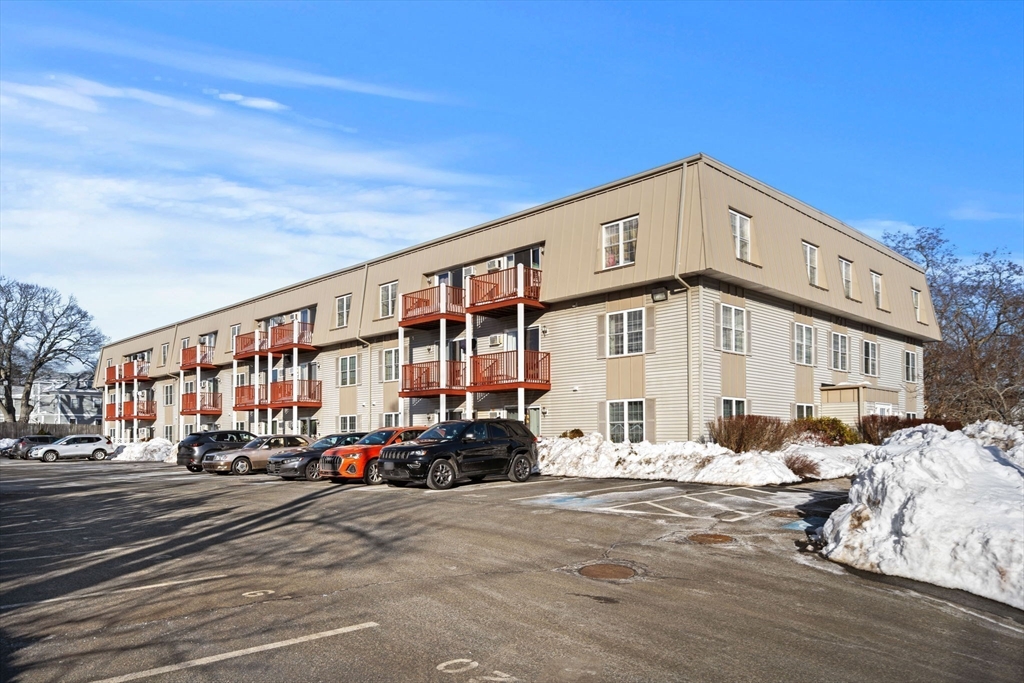 2 Ocean Avenue, Unit 2K Gloucester, MA 01930 - Photo 4 of 26 a front view of a building with street