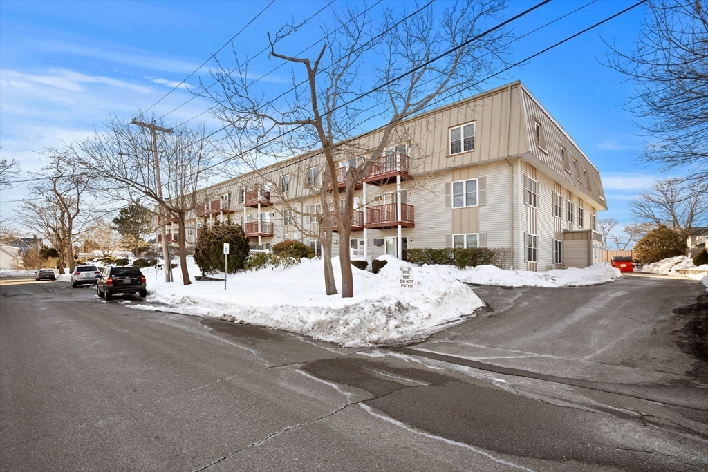 2 Ocean Avenue, Unit 2K Gloucester, MA 01930 - Photo 7 of 26 a view of a building with a road