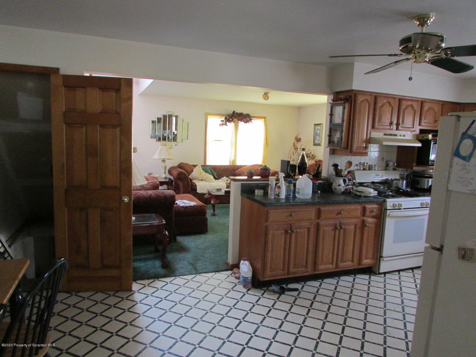 1859 Hunsinger Road Hallstead, PA 18822 - Photo 4 of 19 a kitchen with stainless steel appliances a sink a stove a refrigerator cabinets and a window