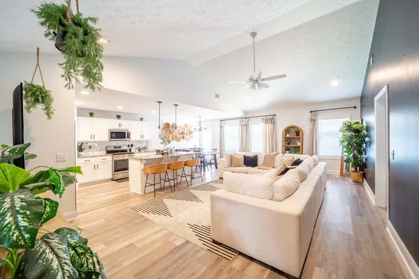 a living room with furniture and a large window