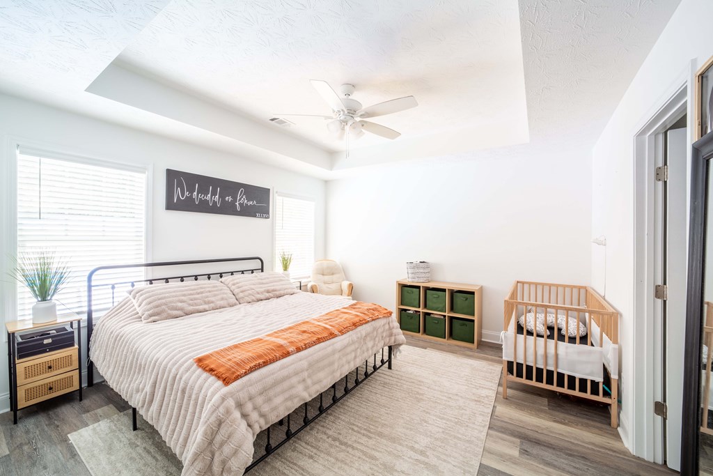 14 Lemon Way Phenix City, AL 36869 - Photo 9 of 13 a bedroom with a bed and wooden floor
