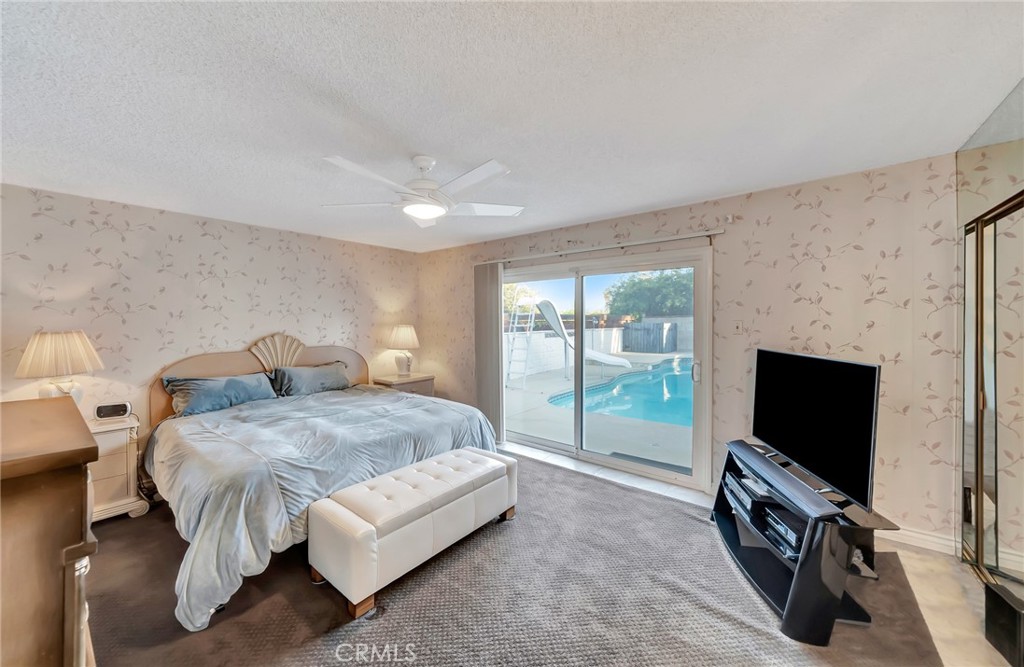 24206 St Edens Circle West Hills, CA 91307 - Photo 14 of 52 a bedroom with a bed and a flat screen tv