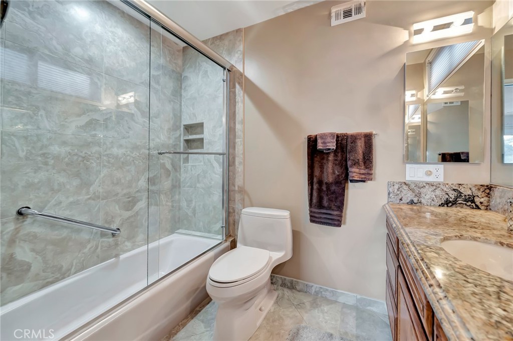 24206 St Edens Circle West Hills, CA 91307 - Photo 17 of 52 a bathroom with a toilet a sink and bathtub