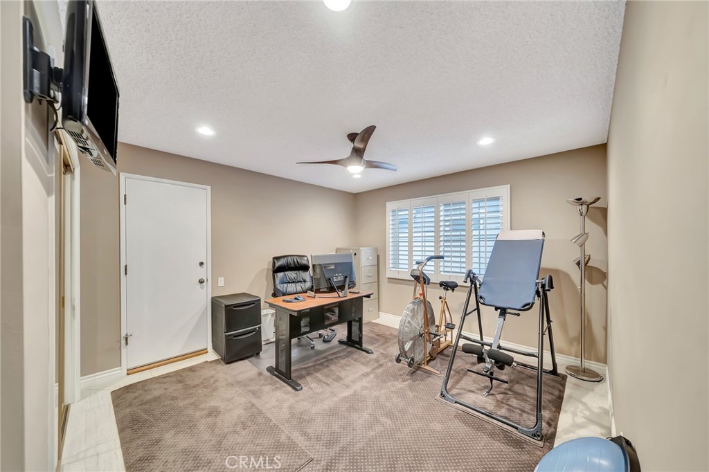 24206 St Edens Circle West Hills, CA 91307 - Photo 18 of 52 a view of a workspace with furniture and a window